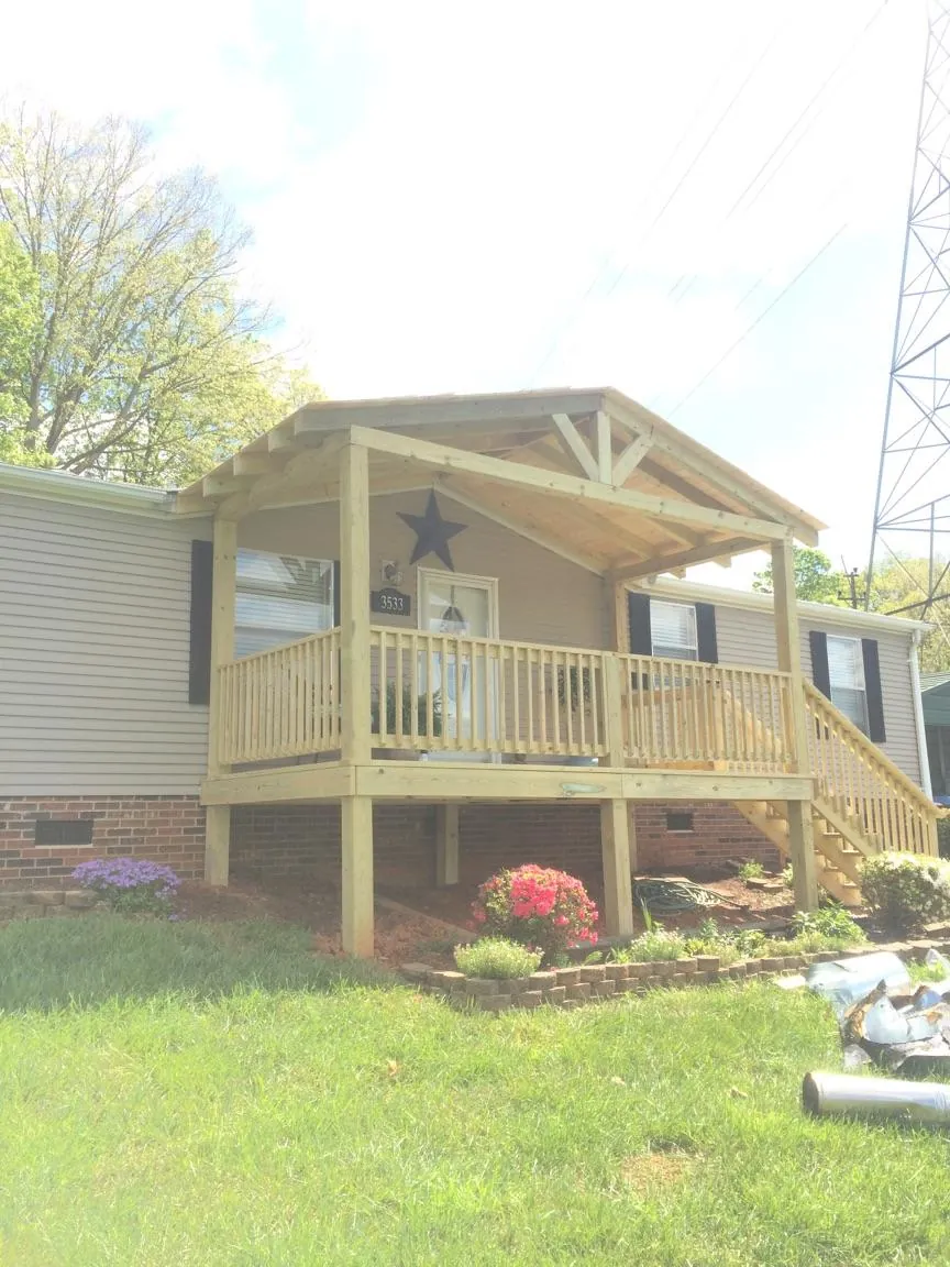 New gabled porch roof and deck railing added to a ranch home in Westerville